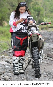 Motorcross Driver Woman Road In Forest. Dirt Motocross Bike Rider Woman. Osaka Japan. March 28, 2021