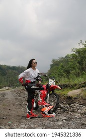 Motorcross Driver Woman Road In Forest. Dirt Motocross Bike Rider Woman. Osaka Japan. March 28, 2021