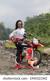 Motorcross Driver Woman Road In Forest. Dirt Motocross Bike Rider Woman. Osaka Japan. March 28, 2021