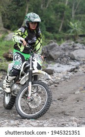 Motorcross Driver Woman Road In Forest. Dirt Motocross Bike Rider Woman. Osaka Japan. March 28, 2021