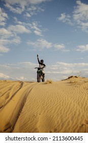 Motorcross Rider With Raised Hand Front View