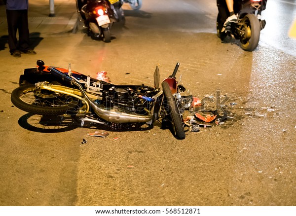 Motorcycle accident on road at\
night 