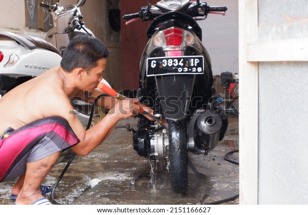The motorcycle is being washed. Central Java,
Indonesia, April 30, 2022