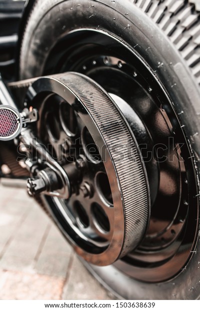 Motorcycle belt drive\
close up rear wheel