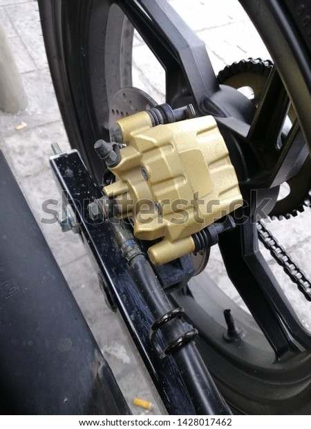 a motorcycle\
break pump with tyre and arm