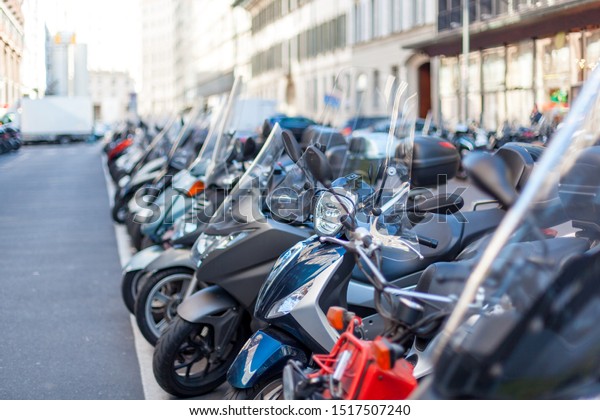 Motorcycle in the center of Milan, Transportation.\
Traveling to Italy.