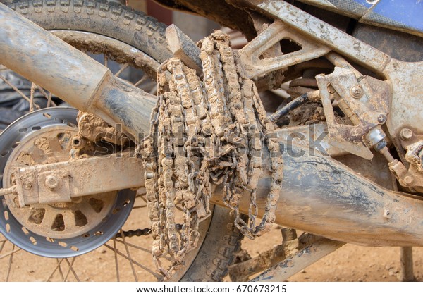 motorcycle chain dirt\
for wheel on mud\
road