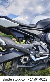 Motorcycle close up on the background of the grass.