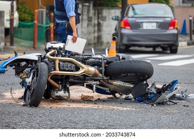 A Motorcycle Collided With A Passenger Car At An Intersection