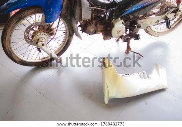 Motorcycle damaged\
from an accident with a\
car.
