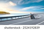 motorcycle drive on the coastal road landscape in summer. Riding a motorcycle is freedom. motorbike driver is speeding along the travel road. Sea view on highway on the Mediterranean beach