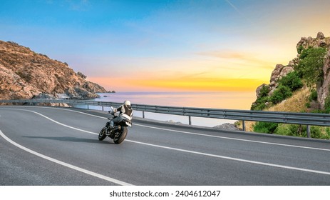 motorcycle drive on the coastal road landscape in colorful beach. Highway view on the shores of the mediterranean sea in summer vacation travel. Beach trip on beautiful travel road in ocean coast. - Powered by Shutterstock