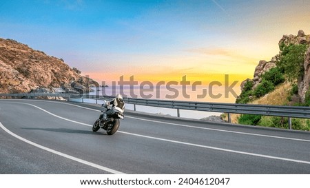 motorcycle drive on the coastal road landscape in colorful beach. Highway view on the shores of the mediterranean sea in summer vacation travel. Beach trip on beautiful travel road in ocean coast.