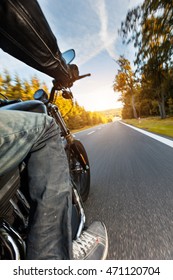 Motorcycle Driver Riding On Motorway In Beautiful Sunset Light. Shot From Pillion Driver View