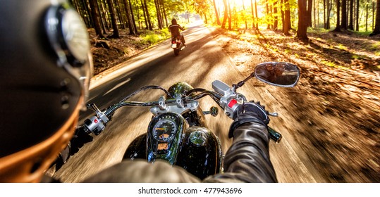 Motorcycle Drivers Riding On Motorway In Beautiful Sunset Light. Shot From Pillion Driver View