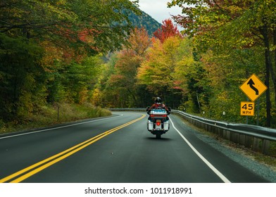 Motorcycle Driving On The Road On The White Mountains During The Fall, New Hampshire, USA