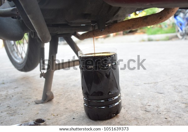 Motorcycle\
engine oil change - changing the engine\
oil