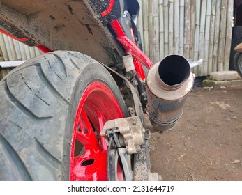 Motorcycle Exhaust And Tires That Look Dirty