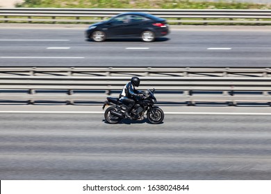 A Motorcycle Fast Driving On Motorway, Side View