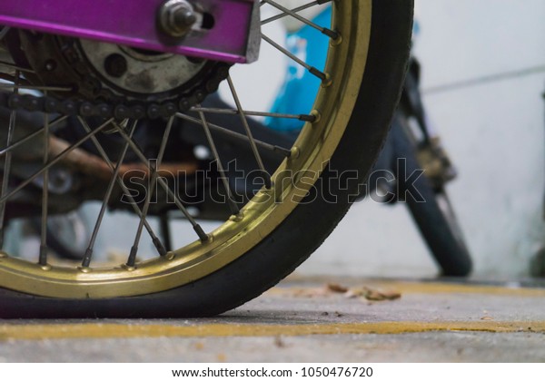 motorcycle Flat tire in the\
parking lot