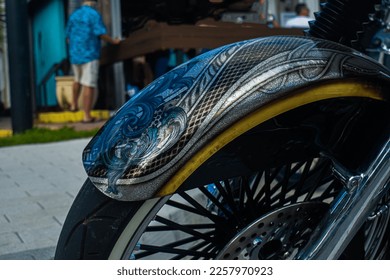Motorcycle front tire close up with beautiful art on metal fender - Shutterstock ID 2257970923