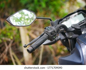 Motorcycle Handlebars With The Throttle Grip And Mirror