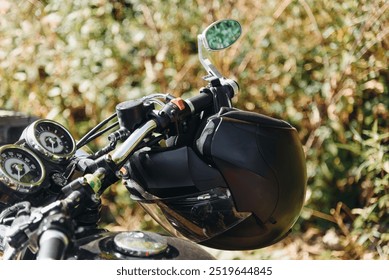 motorcycle helmet hanging on motorcycle handle