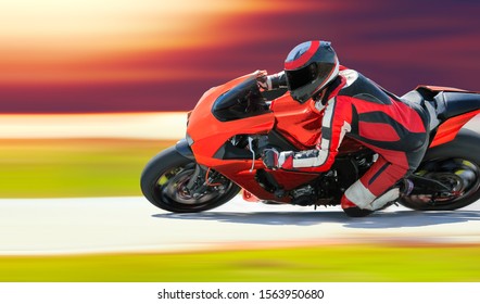 Motorcycle Leaning Into A Fast Corner On Race Track