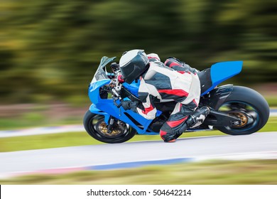 Motorcycle Leaning Into A Fast Corner On Highway