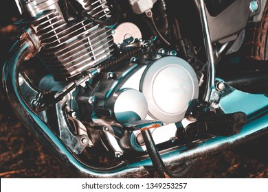 motorcycle. the main part of the engine. there is dirt on it. close-up.