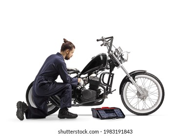 Motorcycle mechanic with a tool box repairing a chopper motorbike isolated on white background - Powered by Shutterstock