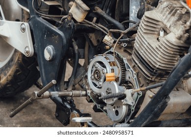 Motorcycle mechanics are assembling the motorcycle engine clutch assembly and maintenance.	 - Powered by Shutterstock