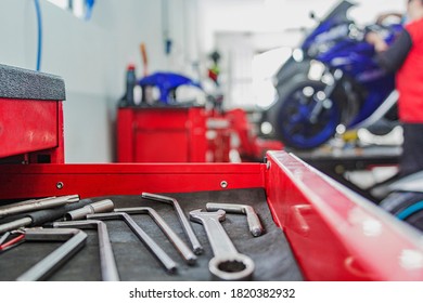 motorcycle mechanics workshop, professional tools, selective focus - Powered by Shutterstock