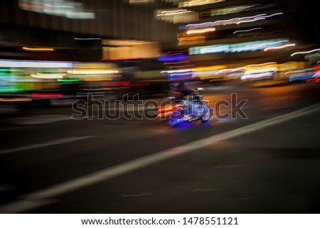Motorcycle in motion on the night street 