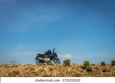 motorcycle parked on road low angle image is taken at Koshi bridge saharasa bihar india. It is the serene beauty of bihar. - Powered by Shutterstock