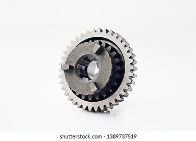 Motorcycle Part. Old Metal Gear Wheel Or Pinion Part , Motorcycle Gear Driven Gear Reduction Ratio  Isolated On White Background.                               