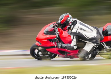 Motorcycle Practice Leaning Into A Fast Corner On Track