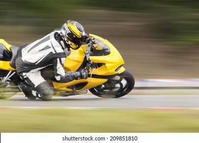 Motorcycle Practice Leaning Into A Fast Corner On Track