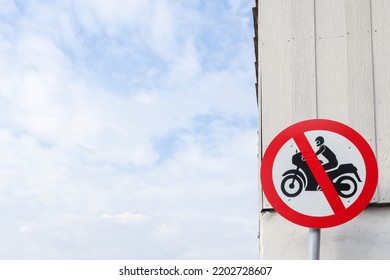 Motorcycle prohibition signs are installed in community areas to prevent motorcycles from entering area to prevent accidents. exercise area has installed signs prohibiting motorcycles from entering  - Shutterstock ID 2202728607