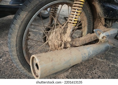 Motorcycle Rear Wheel Full Of Mud In The Rainy Season