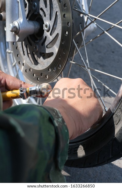 Motorcycle repair\
service technician, tire\
refills