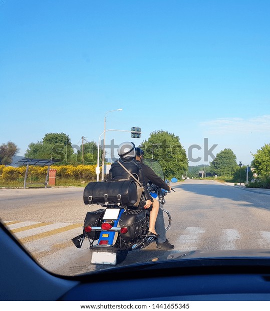 motorcycle retro and a couple traveling in spring\
morning greece