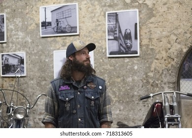 A Motorcycle Rider Poses For A Portrait Photograph At A House Of Vans Promotional Event In London. The Event Was Designed To Showcase A History Of Motorcycles In Britain. July 2017