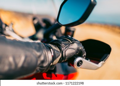 Motorcycle Riders Gloved Hand On The Throttle