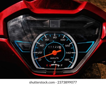 Motorcycle speed displays, speedometers, odometers show that approximately 11,122 kilometers and 200 meters have been used. - Powered by Shutterstock