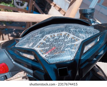 A motorcycle speedometer that cracked the glass due to exposure to heat