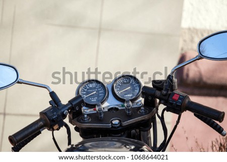 Similar – Senior man steering motorcycle on road