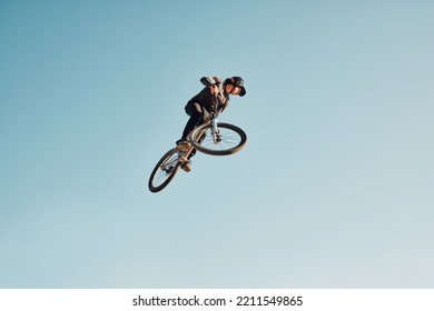 Motorcycle Stunt, Man Cycling In Air Jump On Blue Sky Mock Up For Sports Action Performance, Fitness Training Or Outdoor Bike Performance. Professional Sports Person With Bmx Bicycle Adventure Mockup