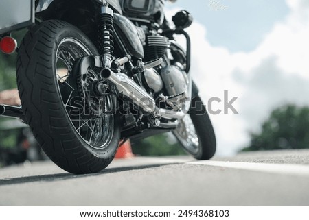 Similar – Image, Stock Photo Black motorcycle on road over nature background