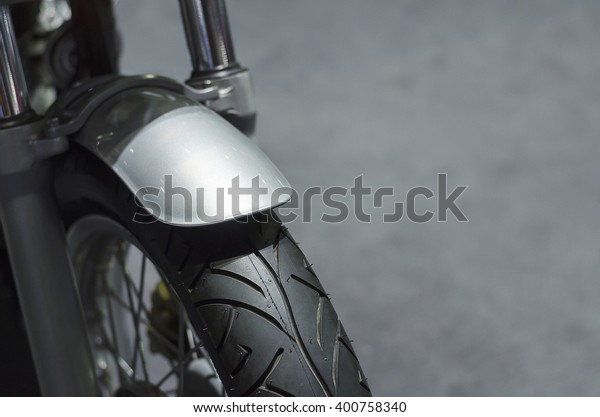 Motorcycle tire with\
mudguard